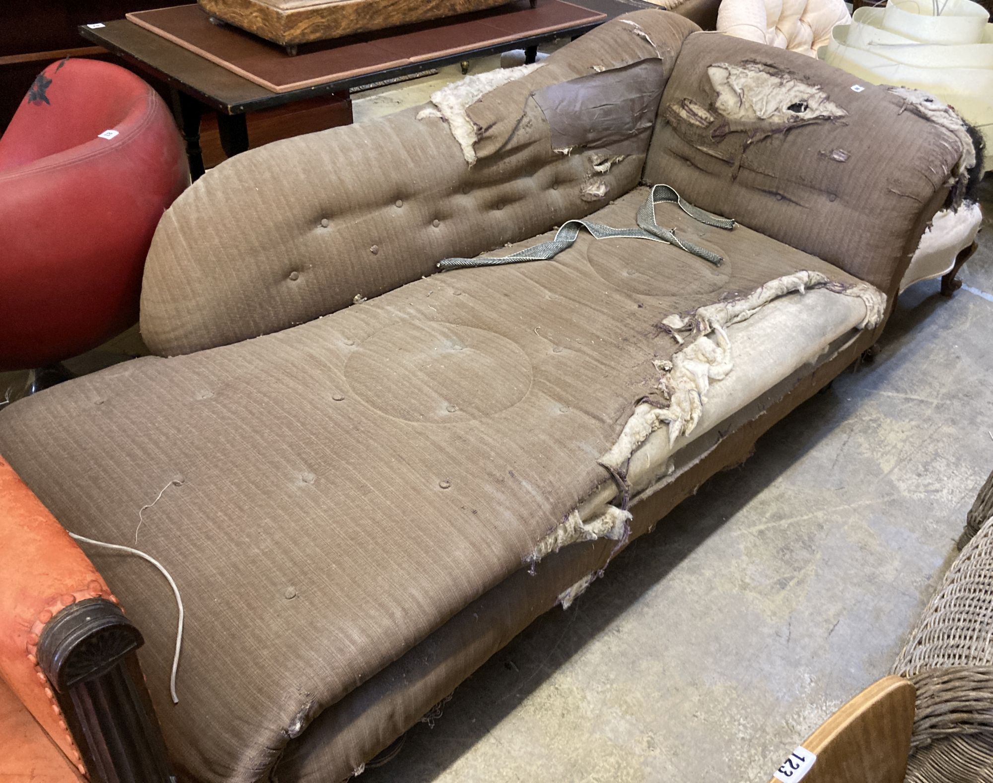 A Victorian chaise longue on turned bun feet, in need of re-upholstery, length 210cm, depth 93cm, height 70cm